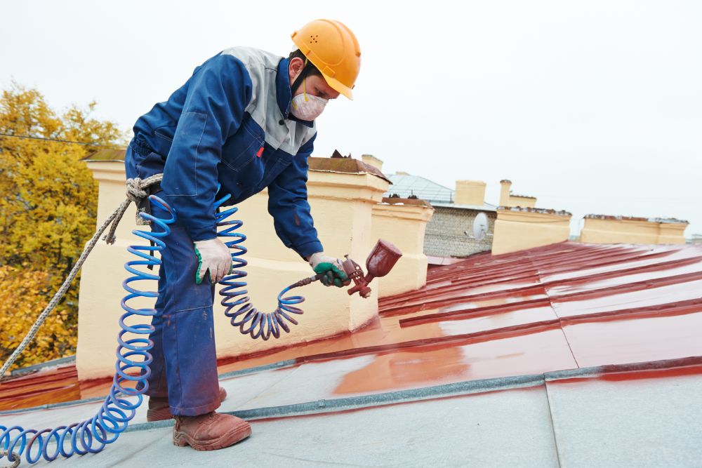 Man applying roof coating